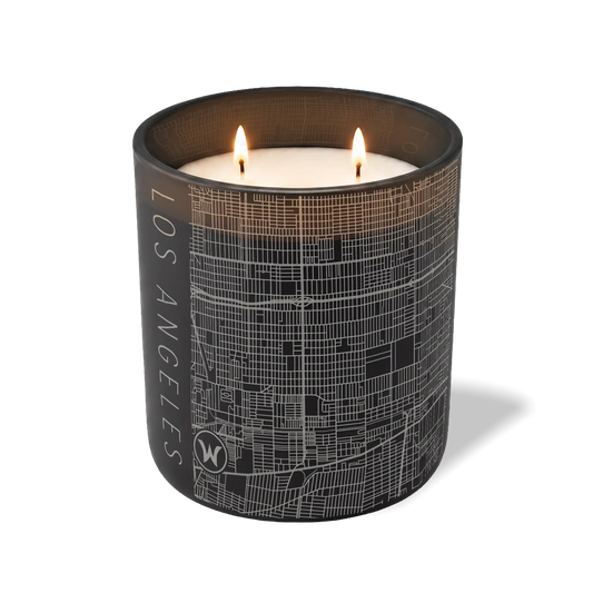 Los Angeles map 12 oz candle with lit wicks and etched street map — black container