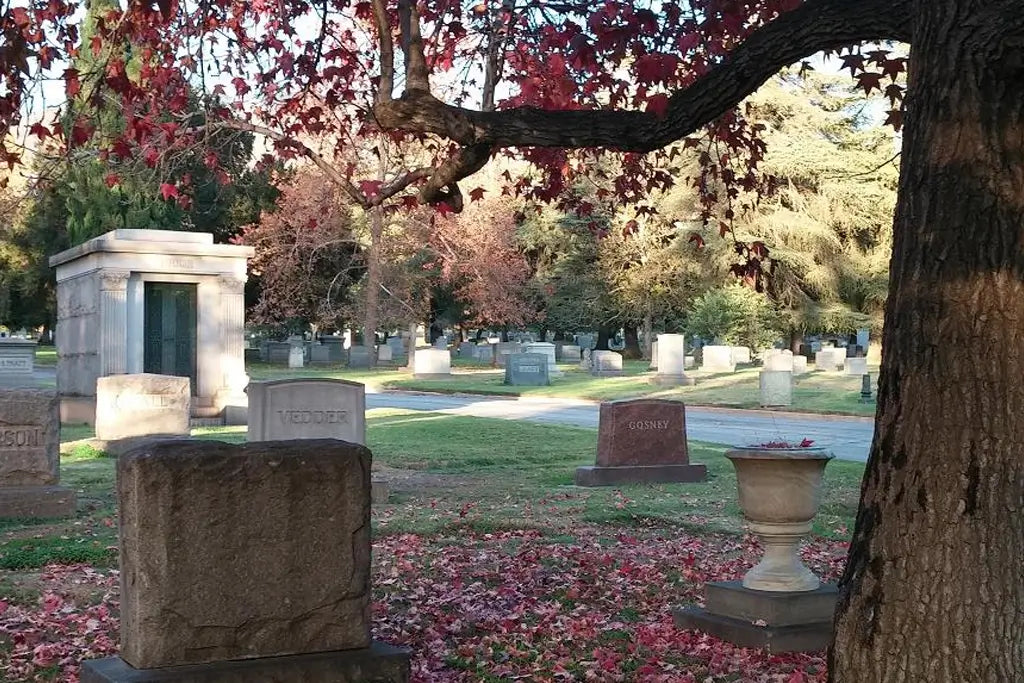 Autumn leaves frame the historic monuments and peaceful paths of Mountain View Cemetery in Altadena